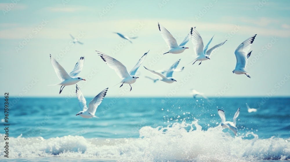 Obraz premium Seagulls Soaring Over Ocean Waves