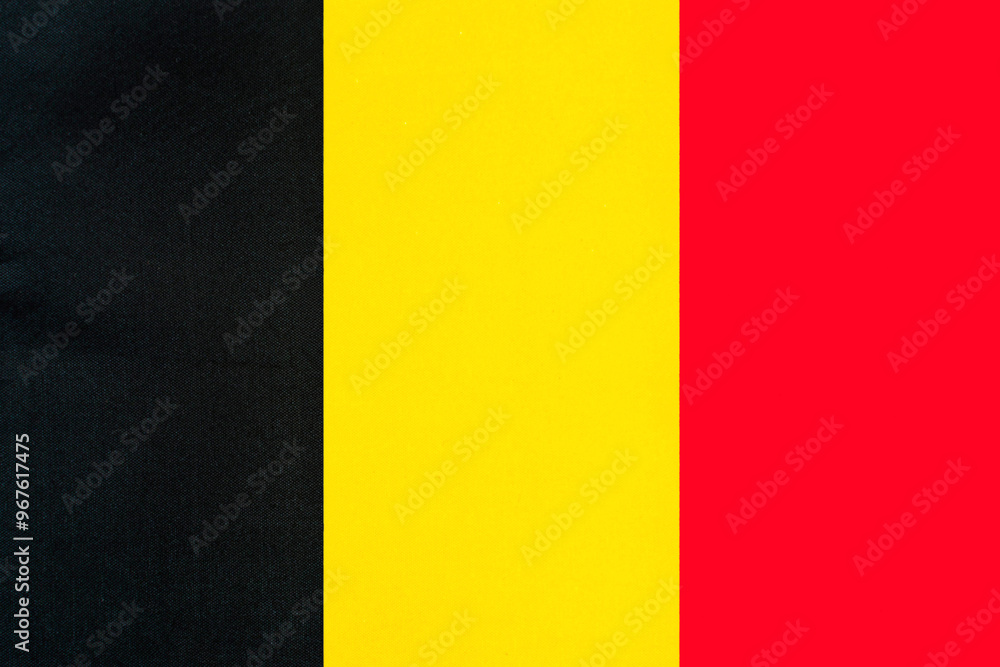Fototapeta premium Belgian national flag with fabric texture close-up