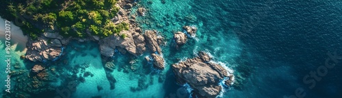 Aerial View of Turquoise Ocean Water with Rocks and Lush Green Vegetation