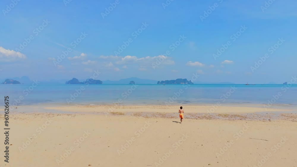 Aerial view of a beautiful tropical beach with clear blue sea and sandy shore, Ko Yao Noi, Thailand. Aerial view of a beautiful tropical beach with clear blue sea and sandy shore, Ko Yao Noi, Thailand.