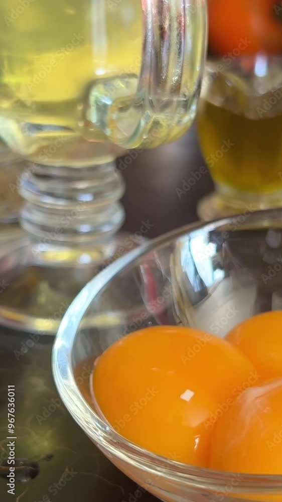 Beaten Egg Yolks in Bowl, Fresh Chicken Eggs for Cooking Recipe, Mixed Organic Yolks in glass Bowl Beaten Egg Yolks in Bowl, Fresh Chicken Eggs for Cooking Recipe, Mixed Organic Yolks in glass Bowl