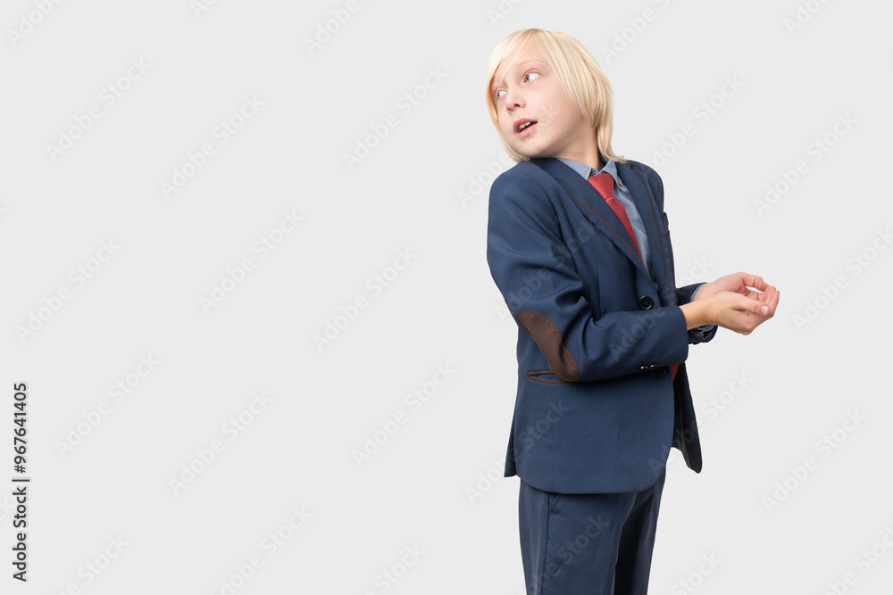 Portrait of a young businessman looking up and thinking over grey background Portrait of a young businessman looking up and thinking over grey background