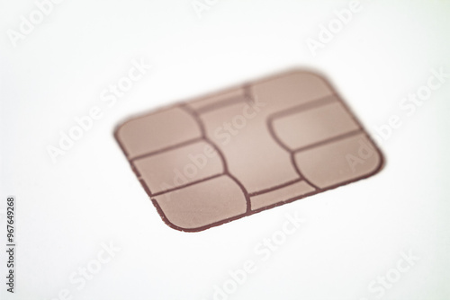 Close-up of a bank card chip demonstrating contactless payment