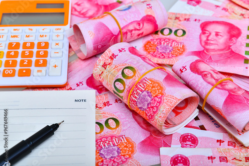 Calculator about savings on rolls 100 Yuan, Chinese money is background