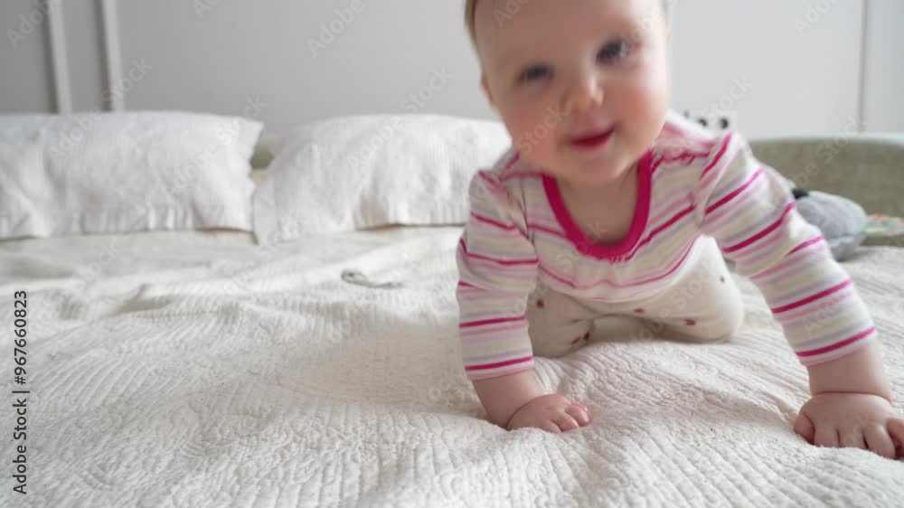 A baby happily crawls on a soft bed, showcasing excitement and joy while exploring the cozy indoor space A baby happily crawls on a soft bed, showcasing excitement and joy while exploring the cozy indoor space