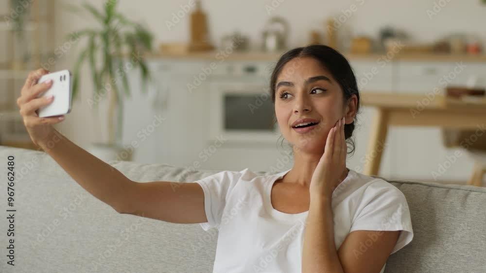 Gadget addict social media addicted Indian woman at home Arabian girl female using mobile phone male photo take picture selfie web camera posing vlogger influencer check result bad dissatisfied shock Gadget addict social media addicted Indian woman at home Arabian girl female using mobile phone male photo take picture selfie web camera posing vlogger influencer check result bad dissatisfied shock
