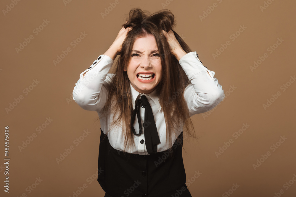 Emotional Brunette Young Woman in Shock. Portrait of Lady Grabbing Head and Tearing Hair in Desperation. Concept of Crisis, Stress, and Overwhelming Situations Emotional Brunette Young Woman in Shock. Portrait of Lady Grabbing Head and Tearing Hair in Desperation. Concept of Crisis, Stress, and Overwhelming Situations