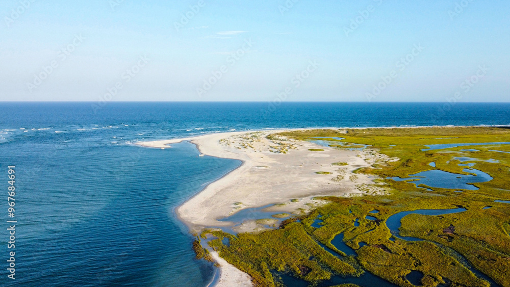 Aerial view of the inlet with sand and grassy marsh Aerial view of the inlet with sand and grassy marsh