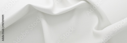 Delicate white fabric with soft folds. 