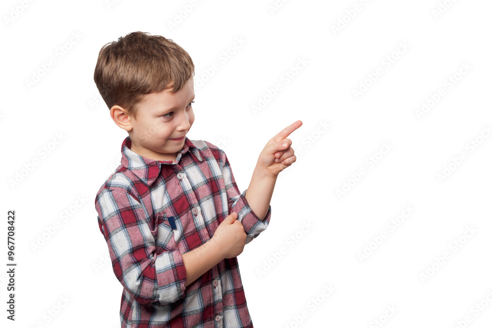 A boy with a bright smile points his finger against a white background, expressing curiosity and enthusiasm in his clear gaze A boy with a bright smile points his finger against a white background, expressing curiosity and enthusiasm in his clear gaze