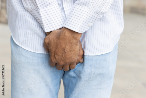 Cuadro en lienzo Middle aged old African man having UTI urinary tract infection or bladder infect