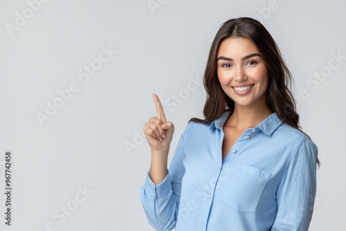 photo beautiful amazing cute she her lady arm hand finger indicate empty space toothy advising buy buyer best low little price wear blue shirt isolated grey background photo