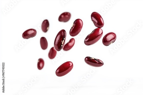 Red kidney beans falling against white background