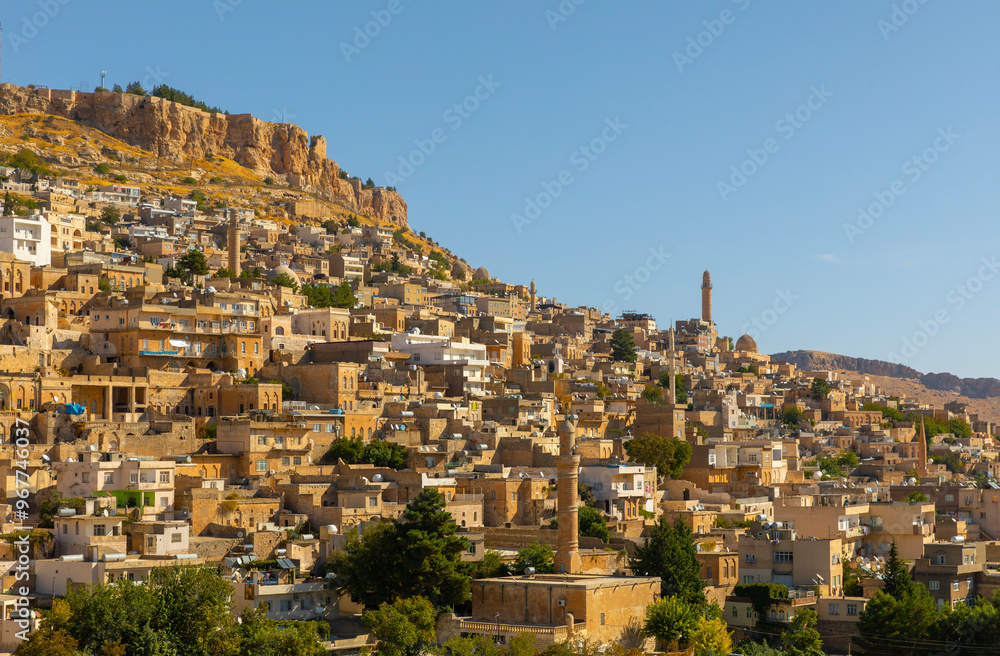 Obraz premium Ancient and stone houses of Old Mardin (Eski Mardin) with Mardin Castle, Located South Eastern of Turkey
