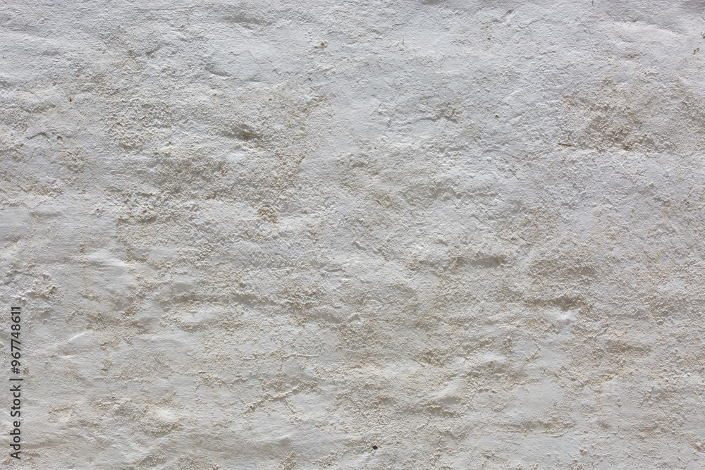 Fototapeta premium Old white wall with cracks and scratches. Abstract background for design
