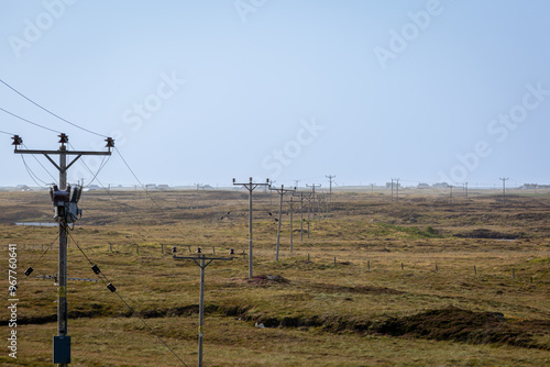 Power line running through the South Uist moorland on a clear summers day photo