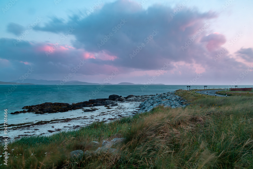 Evening view from a beach in south Uist, Image shows long exposure photo showing a small beach after sunset showing a beautiful blue and purple sky Evening view from a beach in south Uist, Image shows long exposure photo showing a small beach after sunset showing a beautiful blue and purple sky