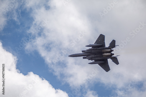 F15 fighter jet taking off with landing gear up, from a public road 