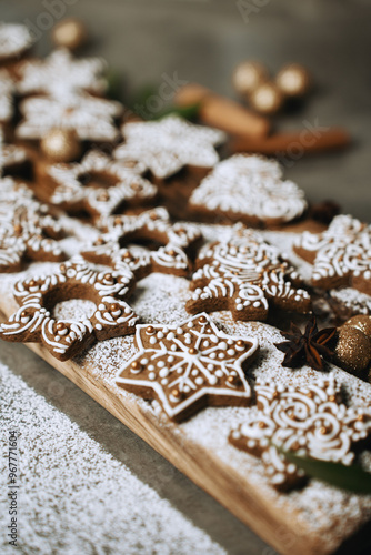 hand-decorated christmas cookies on a wooden background