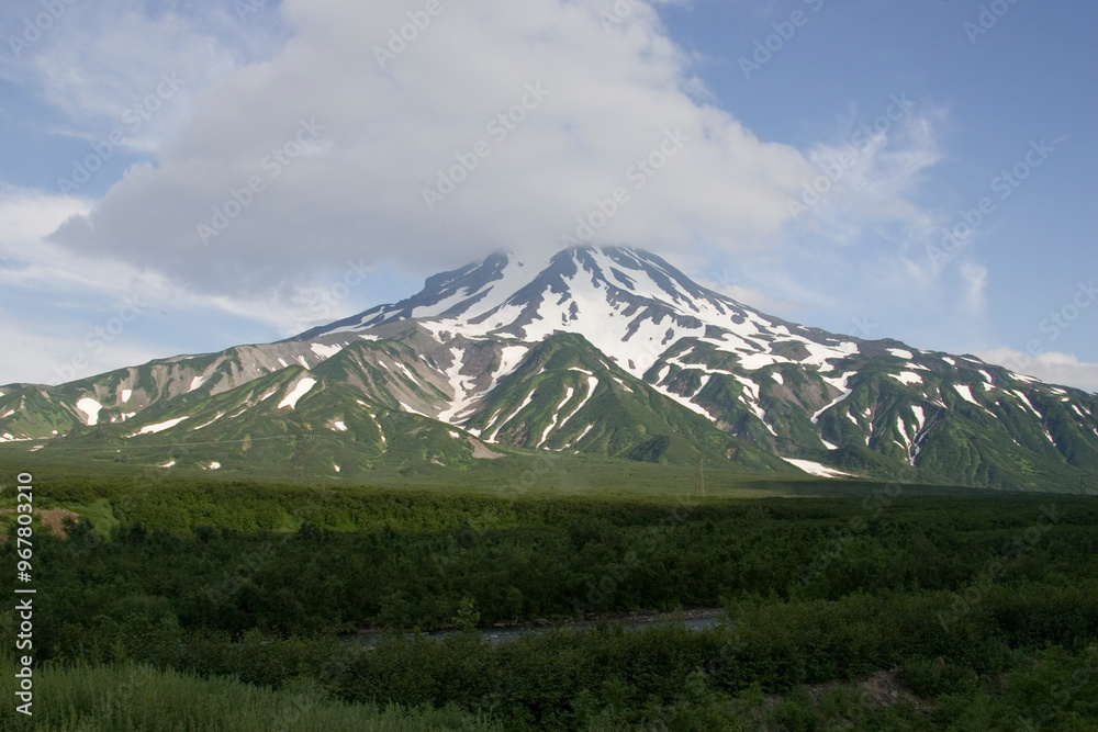 Russia Kamchatka landscape with volcano on a cloudy summer day Russia Kamchatka landscape with volcano on a cloudy summer day