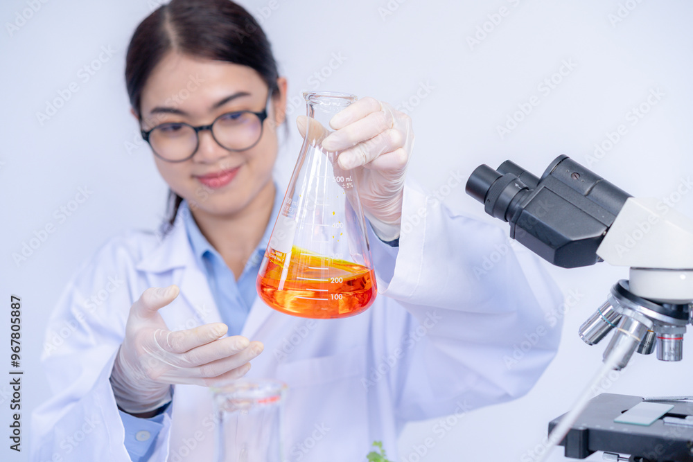 The female scientist with test tubes in the laboratory The female scientist with test tubes in the laboratory