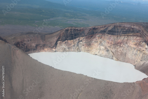 Russia Kamchatka acid lake in Maly Semyachik volcano on a summer cloudy day photo