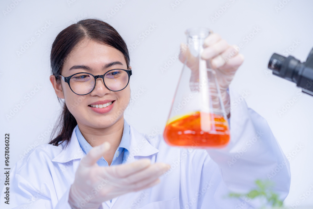 The female scientist with test tubes in the laboratory The female scientist with test tubes in the laboratory