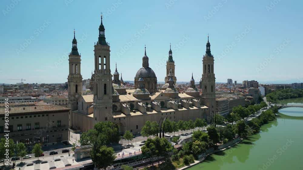 Aerial view of the beautiful Basilica of Our Lady of the Pillar and river in a historic cityscape, Zaragoza, Spain. Aerial view of the beautiful Basilica of Our Lady of the Pillar and river in a historic cityscape, Zaragoza, Spain.