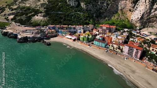 Aerial view of the picturesque rock of Gibraltar with colorful buildings and a scenic beach, Gibraltar.