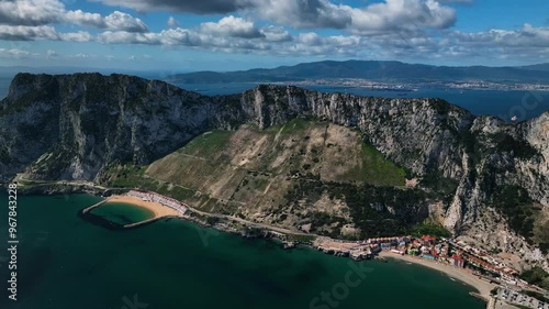 Aerial view of the rock of Gibraltar surrounded by the ocean and clouds, Gibraltar.
