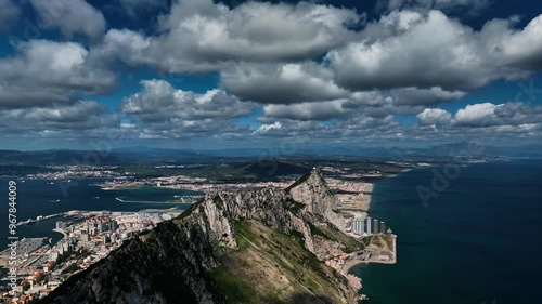 Aerial view of the majestic rock of Gibraltar overlooking the beautiful ocean and port, Gibraltar.