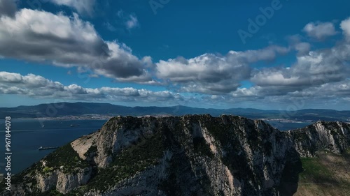 Aerial view of the rock of Gibraltar surrounded by ocean and clouds, Gibraltar.