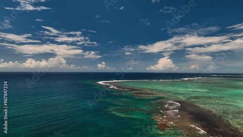 Aerial view of tropical island with pristine turquoise waters and coral reefs, Tuamasaga, Samoa. photo