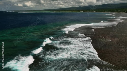 Aerial view of tropical island with pristine reef and azure ocean waves, Tuamasaga, Samoa. photo