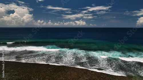 Aerial view of a tropical island with pristine reef and azure ocean waves, Tuamasaga, Samoa. photo