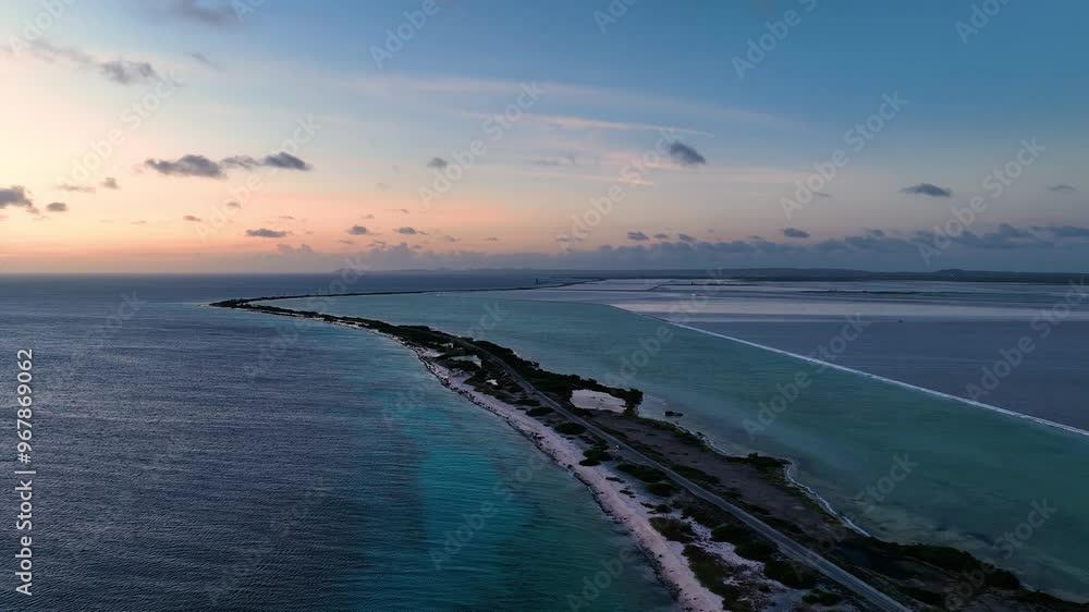 Aerial view of a tropical island at sunset surrounded by turquoise ocean and serene coastline, Caribbean, Netherlands. Aerial view of a tropical island at sunset surrounded by turquoise ocean and serene coastline, Caribbean, Netherlands.