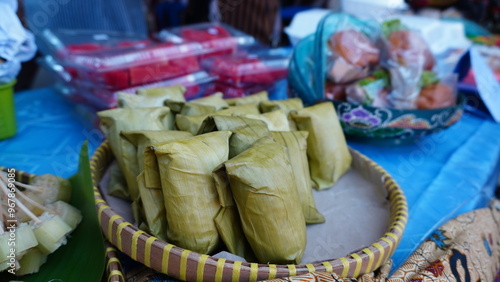 Traditional Javanese cake, Nagasari cake on a street vendor's stall table photo