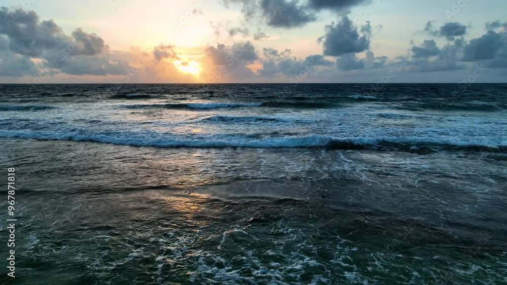 Aerial view of a tropical island at sunrise with serene ocean waves and beautiful clouds, Caribbean. Aerial view of a tropical island at sunrise with serene ocean waves and beautiful clouds, Caribbean.