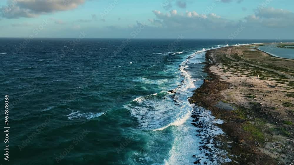 Aerial view of a serene tropical coastline with azure waters and rocky shores, Caribbean, Netherlands. Aerial view of a serene tropical coastline with azure waters and rocky shores, Caribbean, Netherlands.