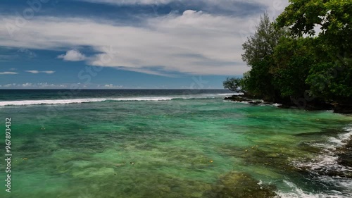 Aerial view of a tropical island with pristine beach, azure ocean, and lush palms, Shefa Province, Vanuatu. photo