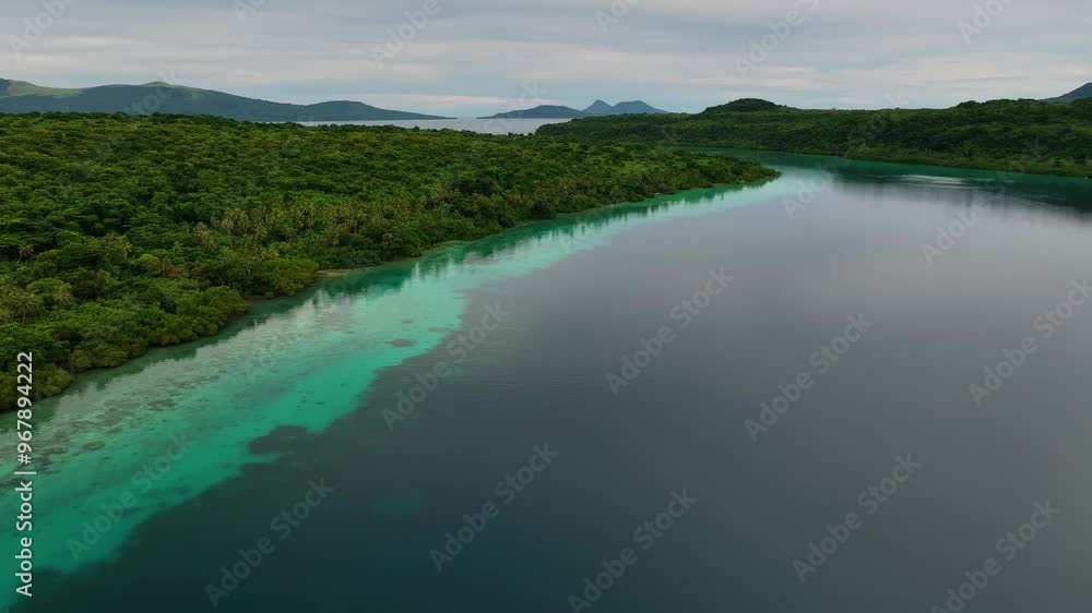Aerial view of a beautiful tropical island lagoon surrounded by pristine reefs and lush palms, Shefa Province, Vanuatu. Aerial view of a beautiful tropical island lagoon surrounded by pristine reefs and lush palms, Shefa Province, Vanuatu.
