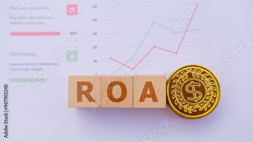 Wooden cube with the word ROA. It is an abbreviation of Return on Assets. Business profitability success growth profitability analytics. Business and financial market concept.