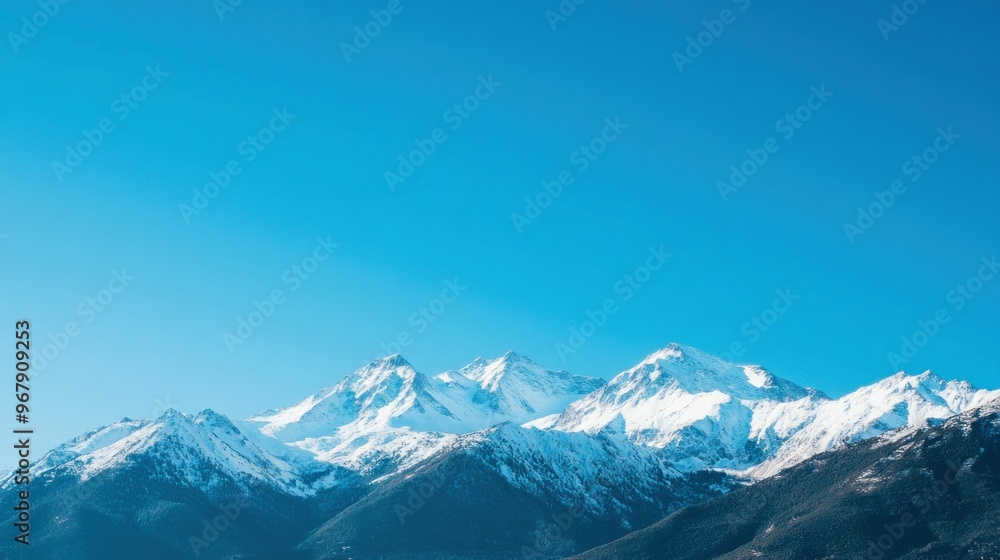 Snow-capped mountains under a clear blue sky, showcasing natural beauty and tranquility. Snow-capped mountains under a clear blue sky, showcasing natural beauty and tranquility.