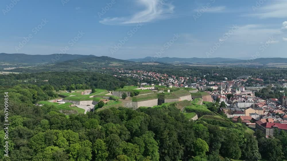 Klodzko Fortress (German: Festung Glatz) – a preserved fortress in Klodzko, a defense system from the 17th and 18th centuries in Poland. Aerial drone view of Klodzko Fortress and town Klodzko Klodzko Fortress (German: Festung Glatz) – a preserved fortress in Klodzko, a defense system from the 17th and 18th centuries in Poland. Aerial drone view of Klodzko Fortress and town Klodzko