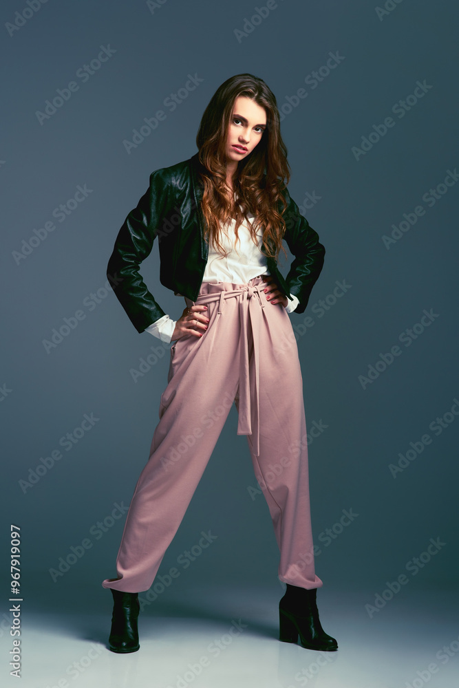 Portrait, woman and fashion with confidence, streetwear and leather jacket on dark background. Female person, style and trendy in studio backdrop as edgy or casual with outfit, clothes and wardrobe Portrait, woman and fashion with confidence, streetwear and leather jacket on dark background. Female person, style and trendy in studio backdrop as edgy or casual with outfit, clothes and wardrobe