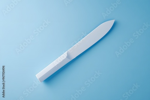 White knife on a blue background.