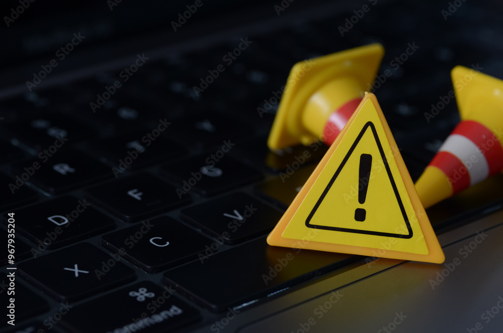 The traffic cones and caution sign represent the potential roadblocks and warnings that users may encounter while using digital devices and services. The traffic cones and caution sign represent the potential roadblocks and warnings that users may encounter while using digital devices and services.