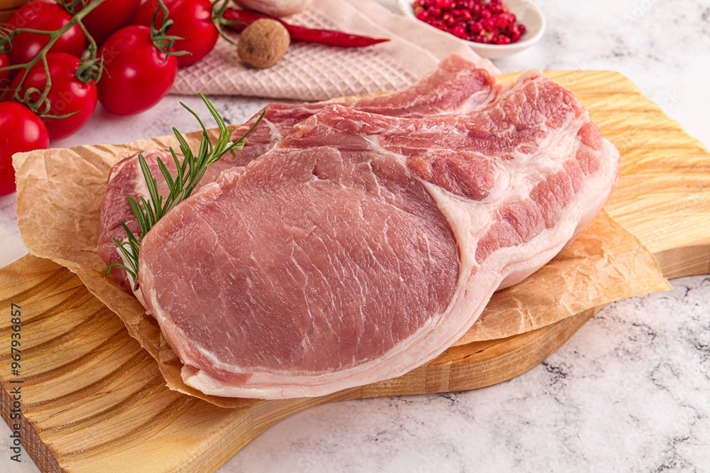Raw potk loin steak with bone Raw potk loin steak with bone
