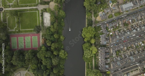 Aerial view of River Ouse with tennis courts and residential area amidst greenery, York, England. photo