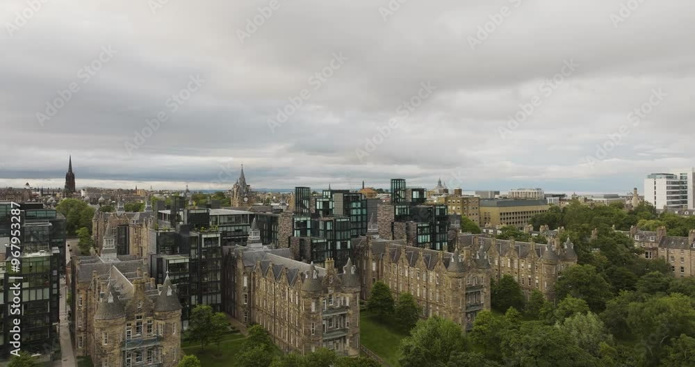 Aerial view of beautiful skyline with historic spires and modern architecture surrounded by greenery, Edinburgh, United Kingdom. Aerial view of beautiful skyline with historic spires and modern architecture surrounded by greenery, Edinburgh, United Kingdom.